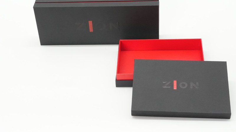 Custom rigid box packaging shown open and closed for structural design reference