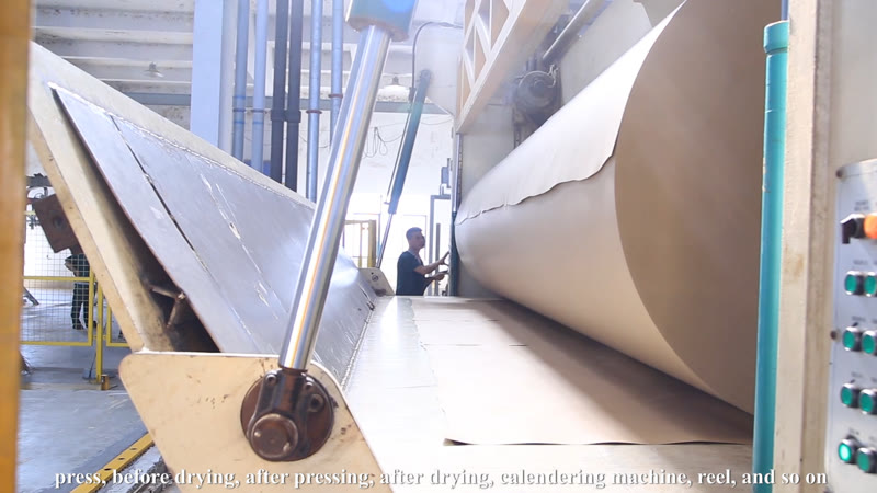 Paper roll moving through a paper production line