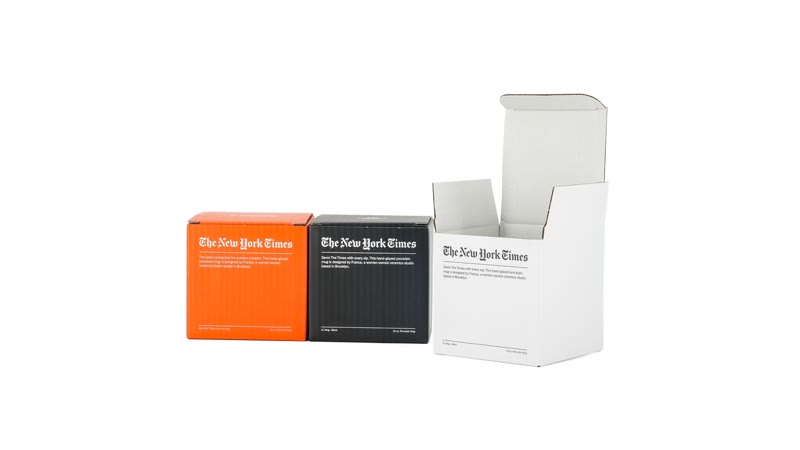 Orange black and white printed cartons showing how packaging color design changes across cartons
