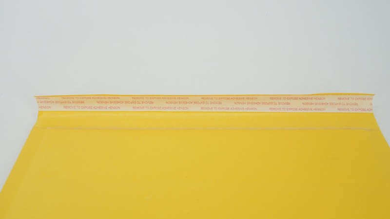 Close view of a self seal bubble mailer flap and adhesive strip