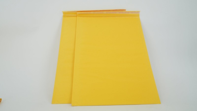 Bubble mailers in several padded sizes beside a ruler and sample product
