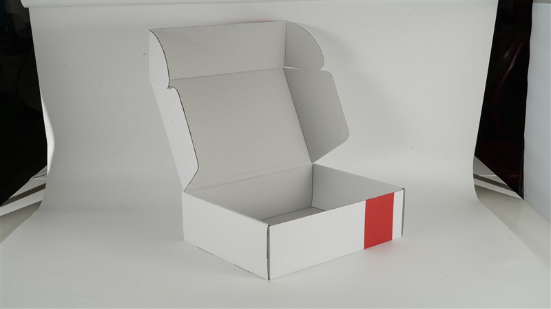 Real photograph of an open white corrugated mailer box