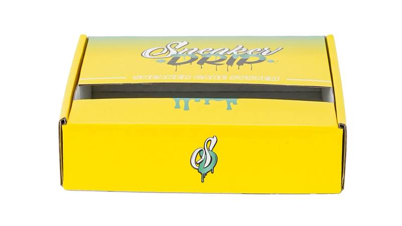 Yellow corrugated mailer box photographed in Colin packaging materials