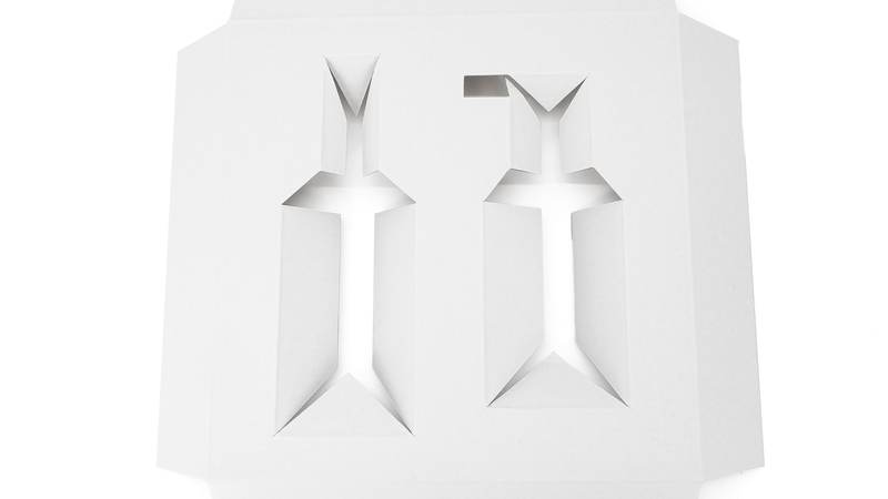 White carton insert structure photographed in Colin packaging materials