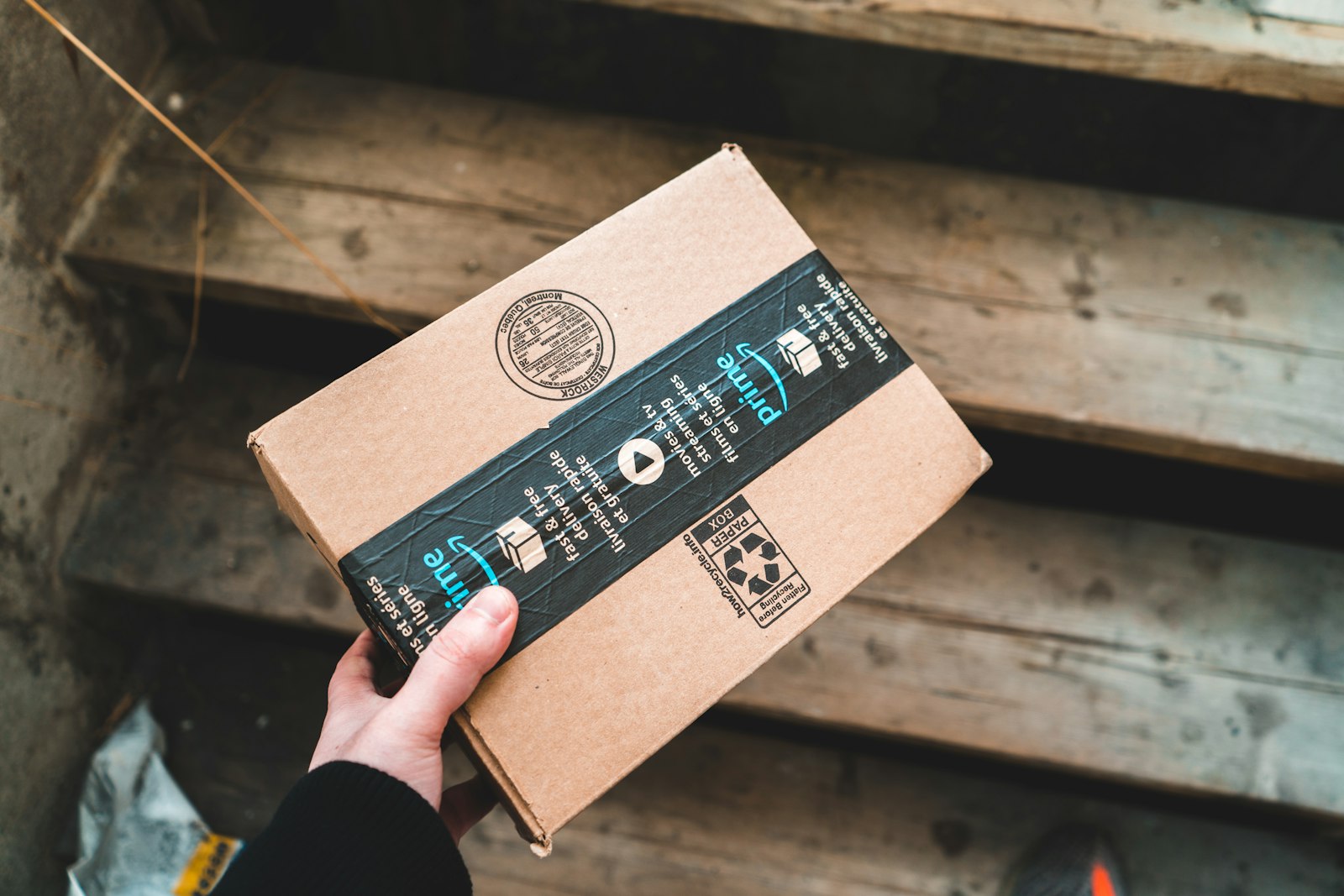 Worker checking the fit of a corrugated shipping box